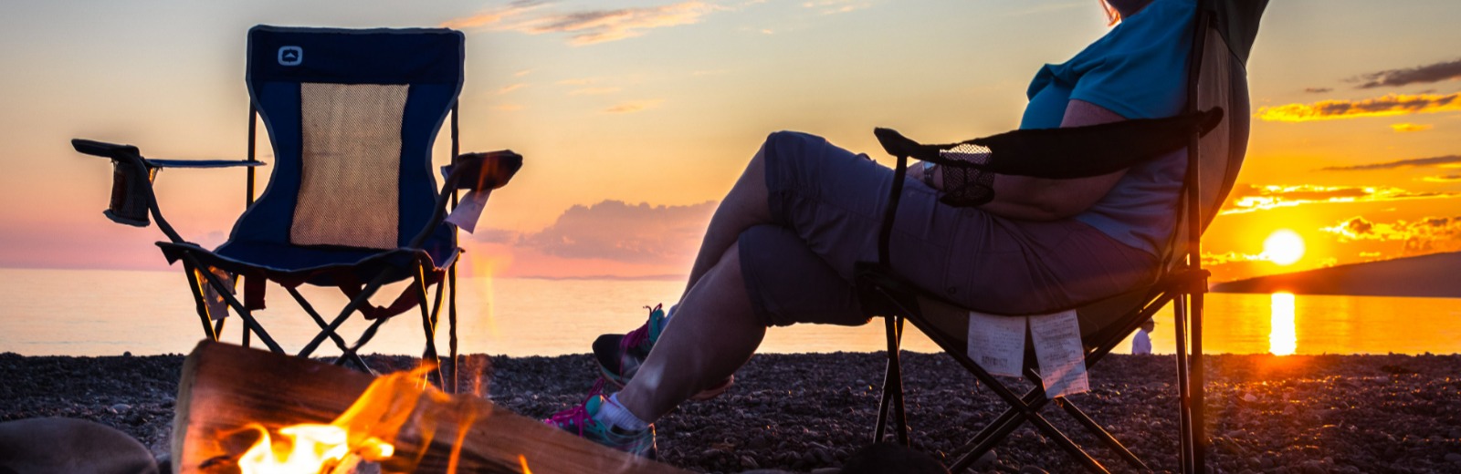 Chair on a beach at sunset