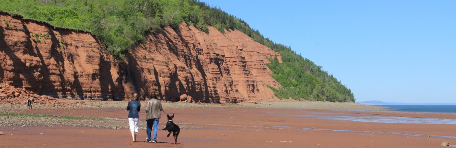 Couple walking on Blomidon Beach