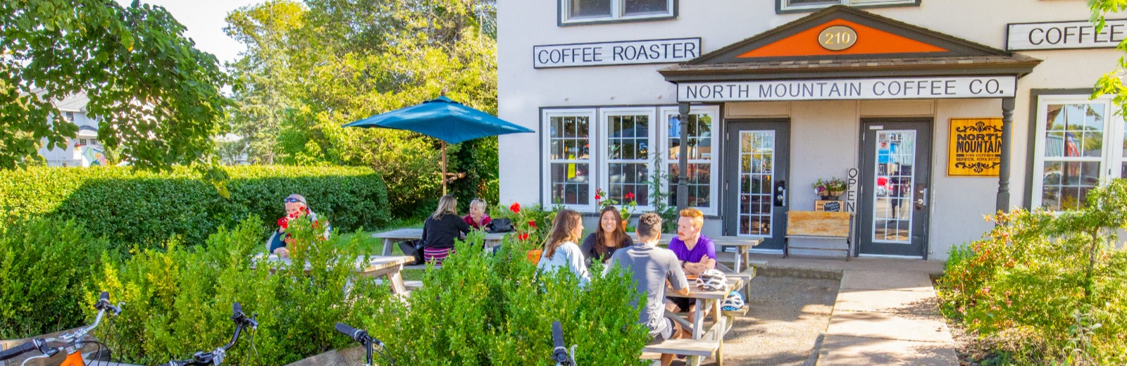 People sitting outside a coffee shop in Berwick