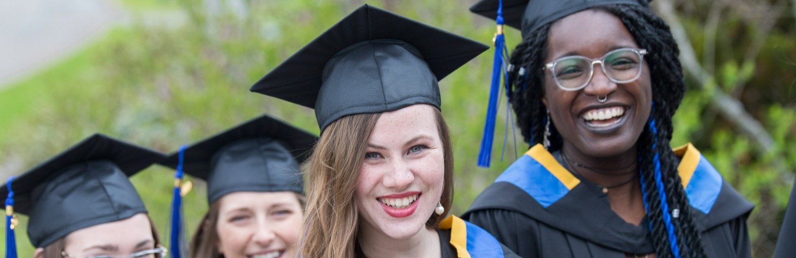 Group of female students in graduation clothes